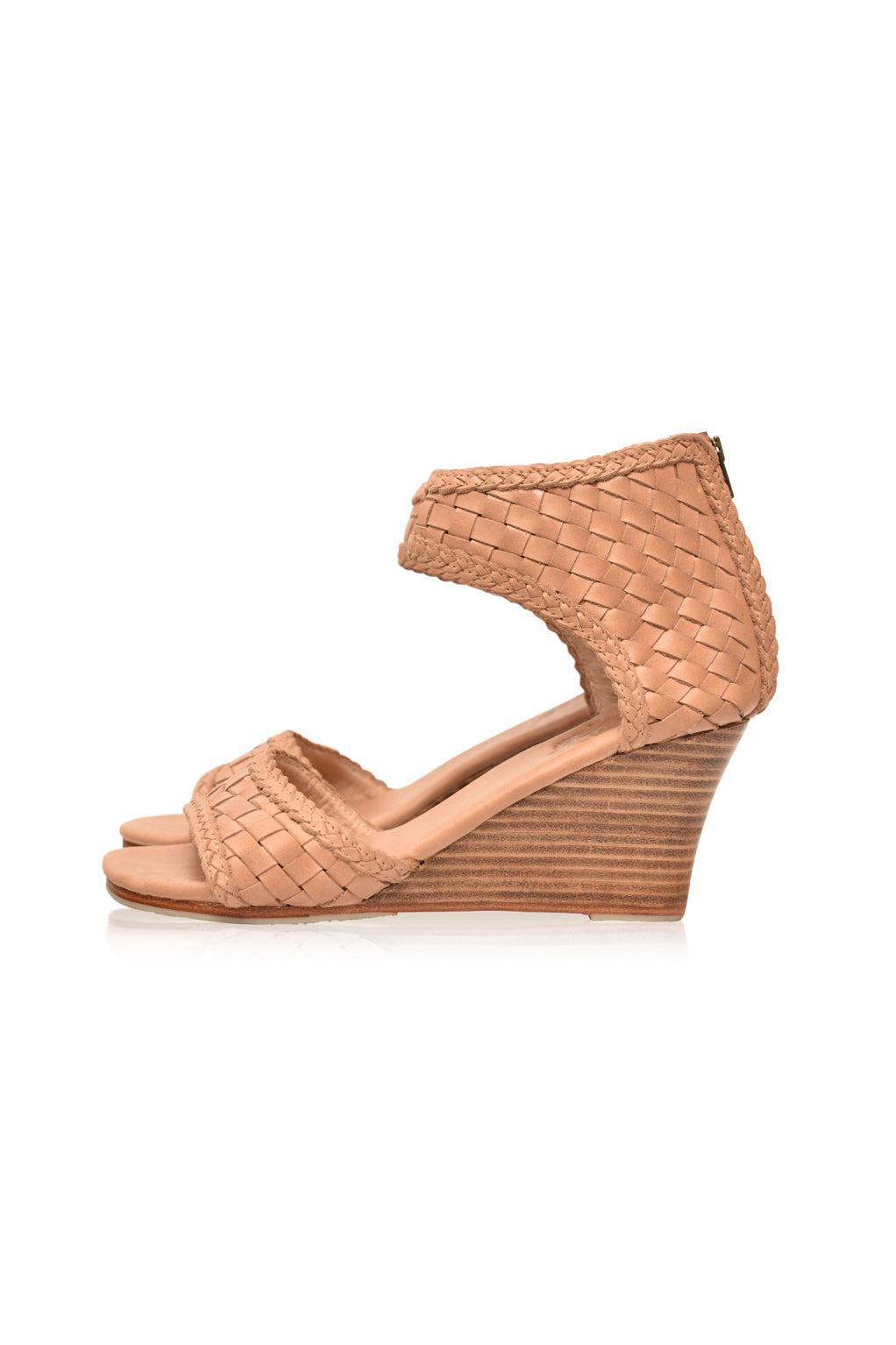 Tan woven wedge sandal on a white background