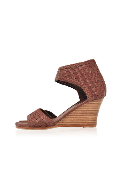 Brown woven wedge sandal on a white background