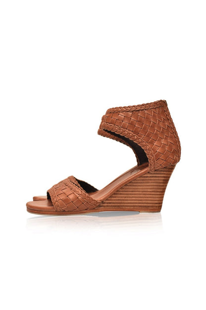 Brown woven wedge sandal on a white background
