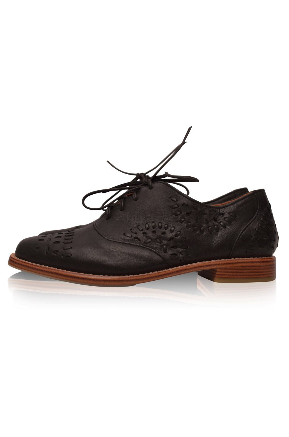 Black leather brogue shoe with brown sole on a white background