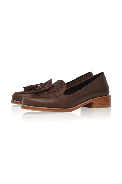 Pair of brown loafers with tassels on a white background