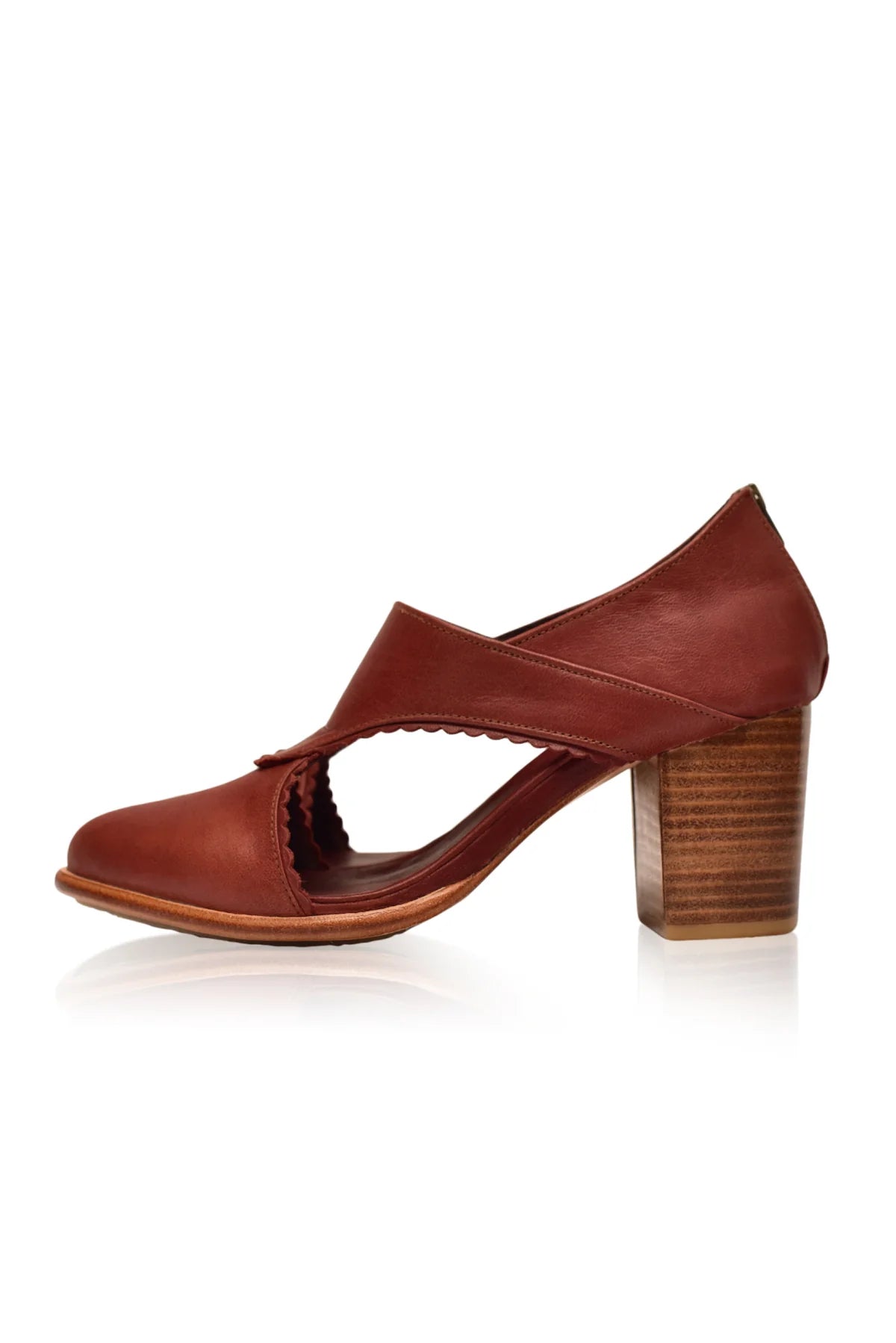 Brown leather shoe with wooden block heel on a white background